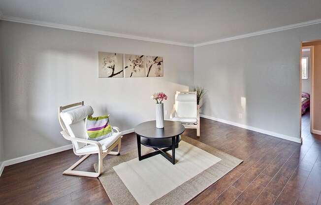 The Post Apartments living area with plank flooring at THE POST Apartments, California