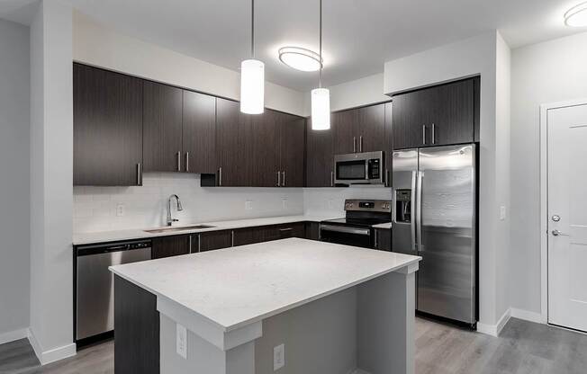 Fully-equipped kitchens with quartz countertops