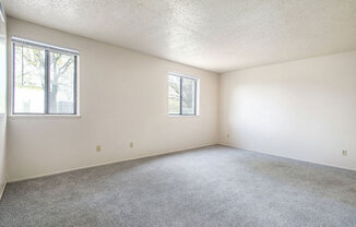 studio living room with two windows at Old Farm Apartments, Elkhart, Indiana