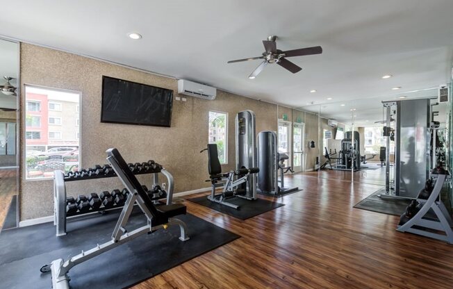 Luxury Apartments in Woodland Hills for Rent- Spacious Fitness Center with Mirrors and Fans and includes Treadmill and Elliptical Machines