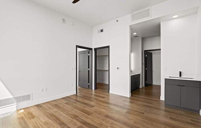 A room with a wooden floor and white walls.