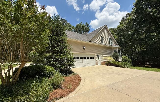 Tranquil and Secluded Raleigh Home with Unique Bonus Features Located on a 7+ Acre Lot on a Private Street with Plenty of Privacy and Outdoor Space
