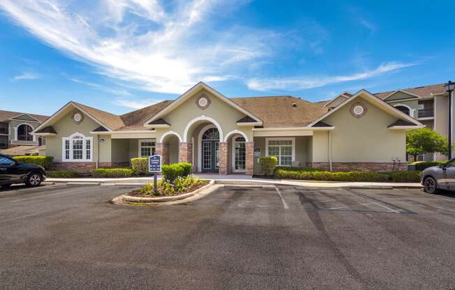 Exterior view of the clubhouse with inviting architecture at Angel Landing apartments in Pensacola, FL