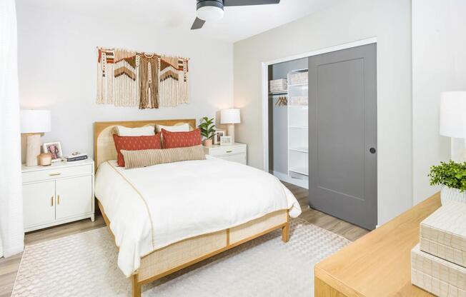 Cozy and bright bedrooms feature sleek ceiling fans, warm neutral tones, and built-in storage to keep your space feeling calm and collected.