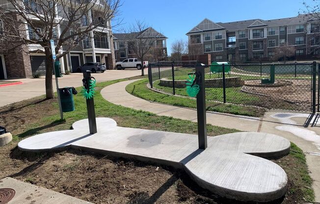 dog park with apartment building in background