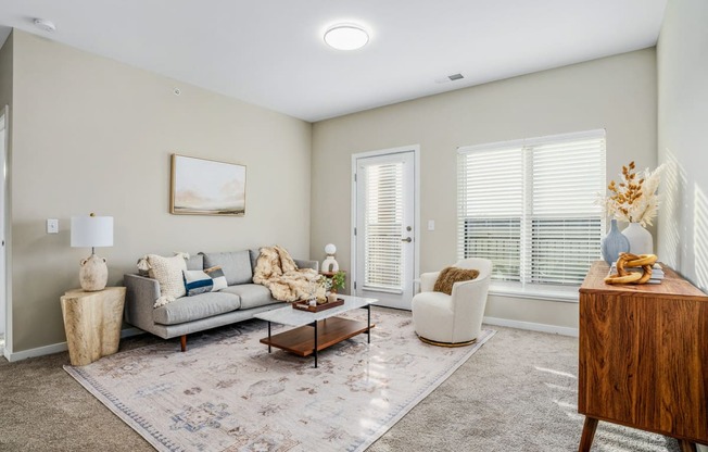 a living room with a couch and a chair