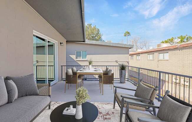 A patio with a table and chairs is shown.