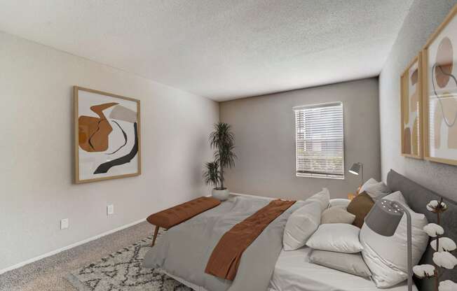 the living room of an apartment with a couch and a bed