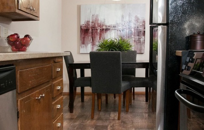 Hard Wood Floors in Kitchen Connecting to Open Dining Room at Boulevard 100 in St. Louis Park, MN