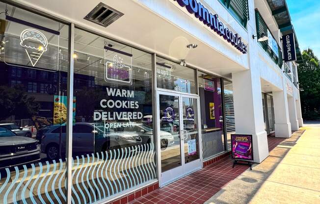 a view of the front of a store with a sign in the window