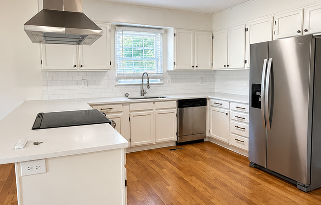 Charming 2 Bed Brick Home with Updated Kitchen, Hardwood Floors & Spacious Backyard