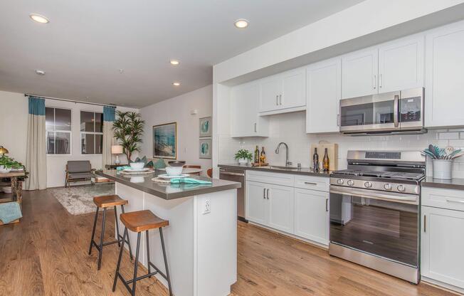a kitchen with an island in the middle of a room