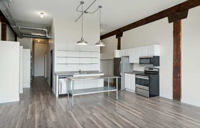 a kitchen and dining area in a 555 waverly unitat Gaar Scott Historic Lofts, Minnesota, 55401