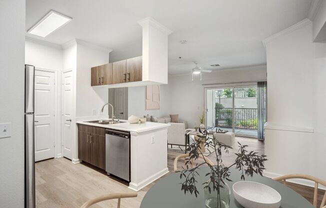 a kitchen and dining room with a table and chairs