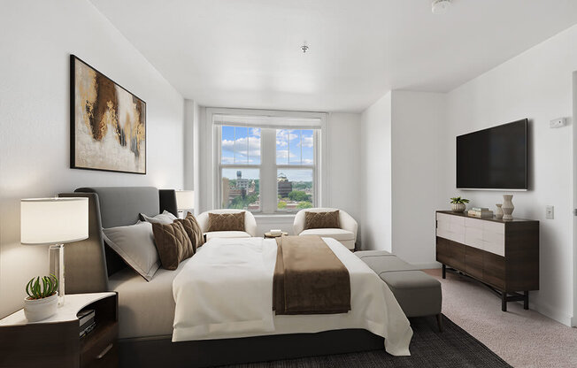 a bedroom with a large bed and a window