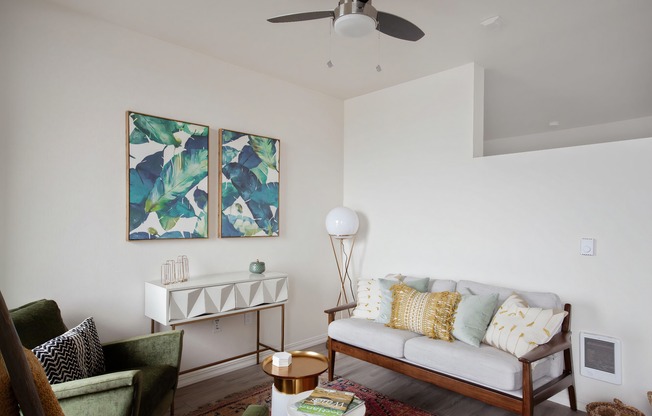 Living room with luxury vinyl plank flooring and ceiling fan