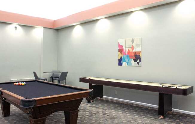 Game room with a black pool table