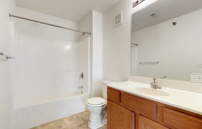 a bathroom with a sink toilet and a shower