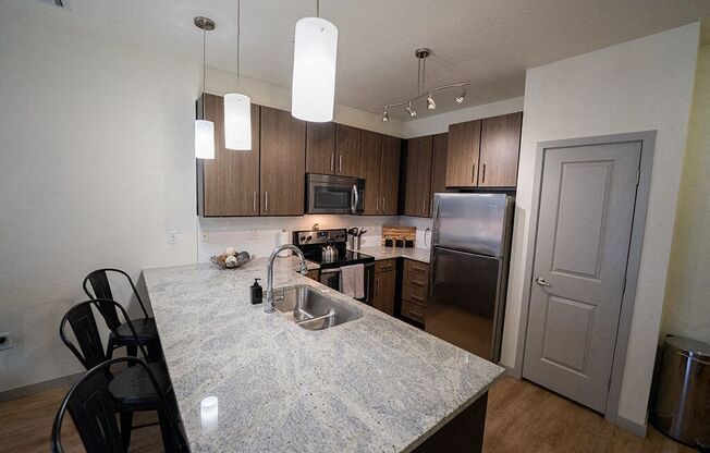 a kitchen with a granite counter top