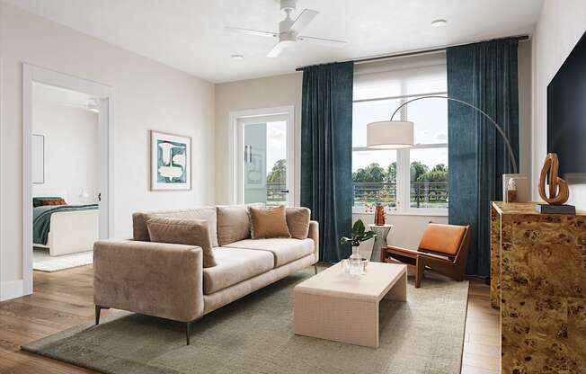 a living room with a couch and a coffee table at Boardwalk at Research Park in Huntsville, AL 35811