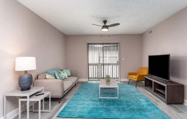 a swimming pool in a living room with a couch and a tv