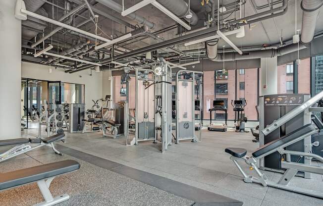 a gym with weights and other exercise equipment in a building  at Cassidy on Canal, Illinois, 60606