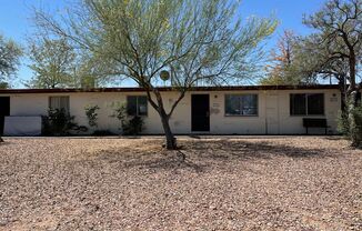 Central 2 bedroom 1 bath unit with Fenced yard.