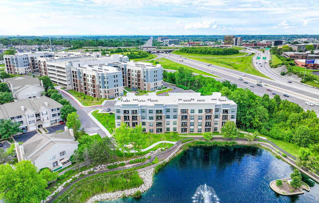 A large building with a fountain in front of it.