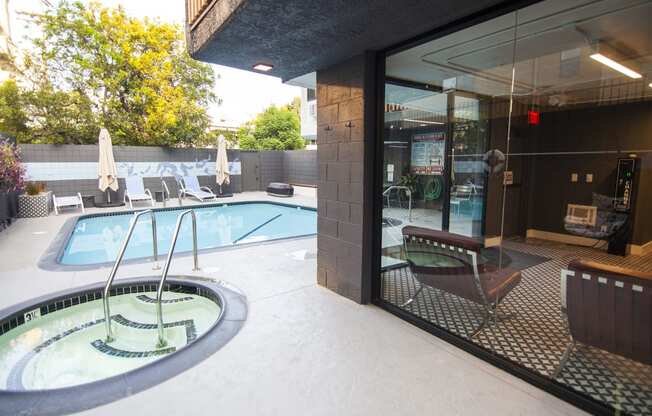 Jacuzzi and swimming pool at Westwood Riviera Apartments, California