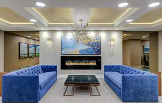 a living room filled with furniture and a fireplace
