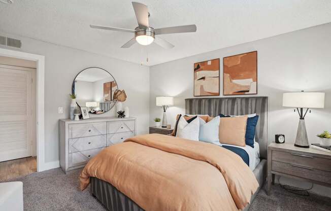 Cozy bedroom with plush carpeting and large windows at Reserve at Drakes Creek