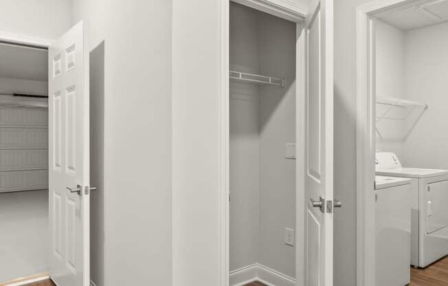 a bedroom with a closet and a door to a bathroom