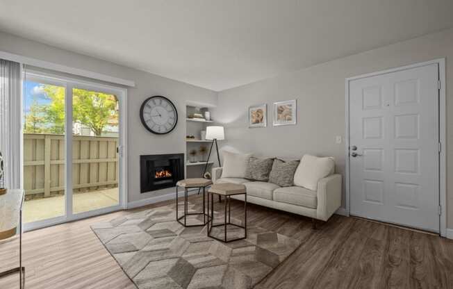 a living room with a couch and a fireplace