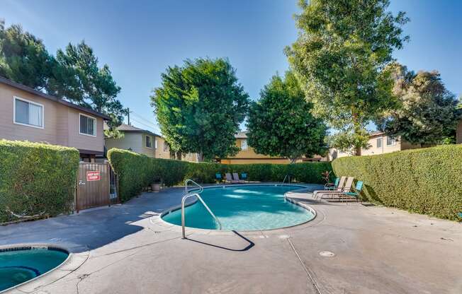 take a dip in the hot tub at villas at houston levee west apartments in