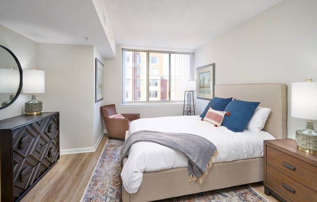 Bedroom in a Newly Renovated Apartment With Wood-Style Flooring Throughout