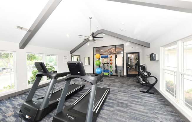 the preserve at ballantyne commons fitness room with cardio equipment and windows