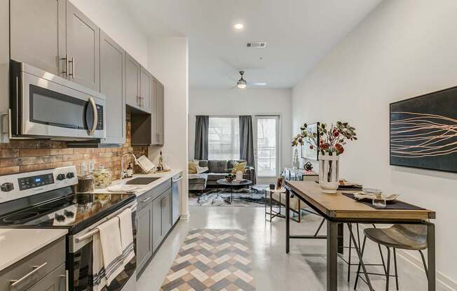 A modern kitchen with a black and white checkered floor.