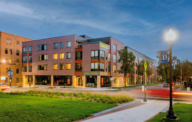 a city street with a building with a street light at Canary Lofts, Des Moines, IA