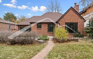 Attractive Brick Tudor With Large Yard In A Very Desirable University Hills Location!