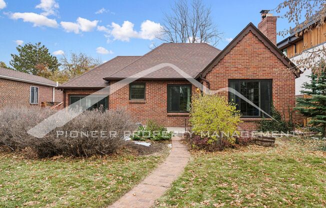 Attractive Brick Tudor With Large Yard In A Very Desirable University Hills Location!