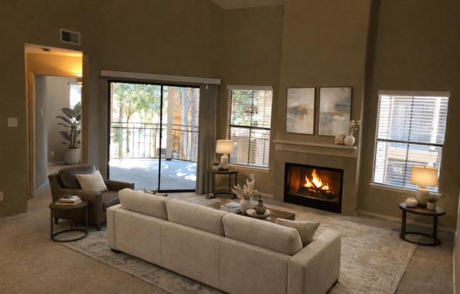 A living room with a fireplace and a couch.