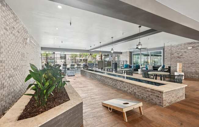 the lobby of a building with a reception desk and a seating area