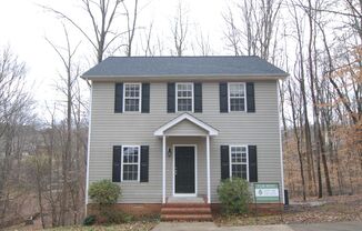 Fabulous 3 bedroom 2.5 bath home in a desirable NW Greensboro neighborhood with large deck overlooking a creek wooded area