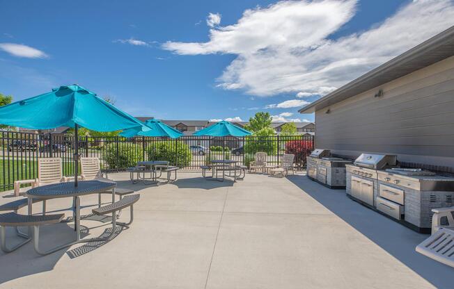 a table topped with a blue umbrella