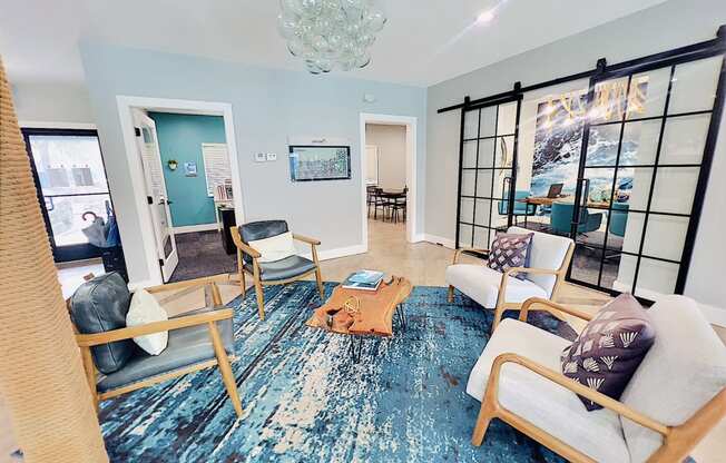 a living room with blue walls and a blue rug