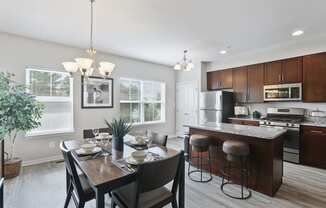 Kitchen and Dining area with wood floors at Townes at Pine Orchard, Ellicott City, 21042