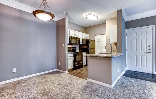 Upgraded kitchen with breakfast bar, granite countertops, black Whirlpool appliances
