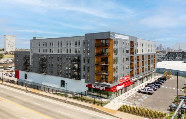 an aerial view of an apartment building and a parking lot