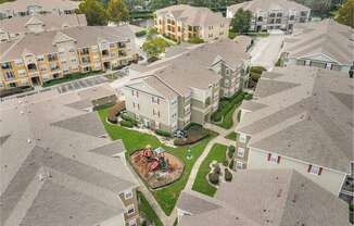 A bird's eye view of a residential area with houses and a playground.