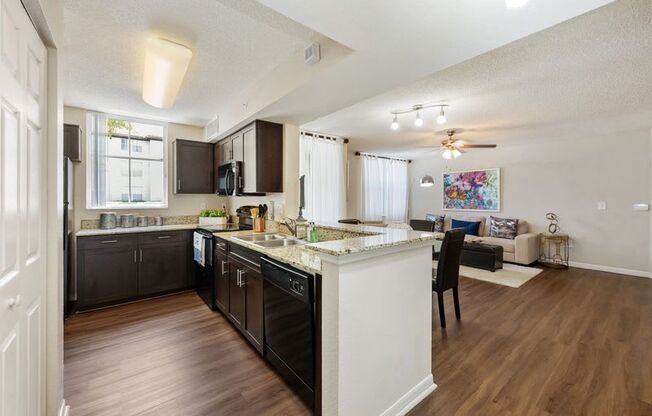 a kitchen and living room with an open floor plan